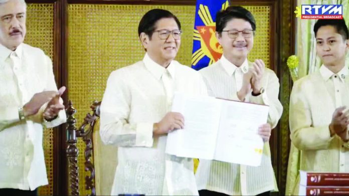 Marcos_slashes_copy_resized_compressed President Ferdinand Marcos Jr. signs into law the P6.7 trillion national budget for 2026 on Jan. 5, 2026. But he vetoed nearly P92.5 billion worth of unprogrammed appropriations. Also in photo are Senate President Vicente Sotto III, House Speaker Faustino Dy, and Cong. Sandro Marcos. SCREENGRAB FROM PRESIDENTIAL COMMUNICATIONS OFFICE