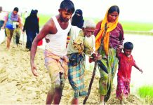 Myanmar begins defense in genocide case at UN court Rohingya refugees walk on the muddy path after crossing the Bangladesh-Myanmar border in Teknaf, Bangladesh. Hundreds of thousands of Rohingya people fled Myanmar during an army crackdown in 2017. REUTERS