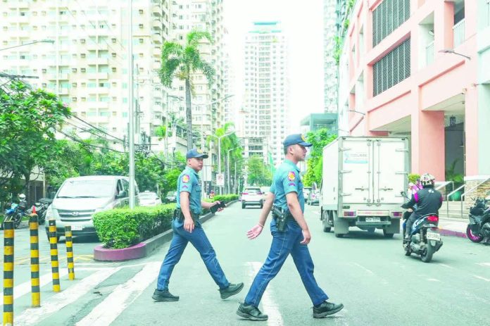 Quezon City Police District officers go around a commercial area in Cubao. Security operations will remain in effect until Jan. 6, including intensified anti-criminality campaigns and motorist assistance along major highways. The Philippine National Police reported a 12.4 percent decline in the country’s overall crime rate in 2025 compared to the previous year. PNA