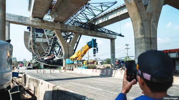 Thailand This is a wide shot of the wreckage of a crane that collapsed on a highway in Thailand. Construction site accidents are not uncommon in this Southeast Asian nation. GETTY IMAGES
