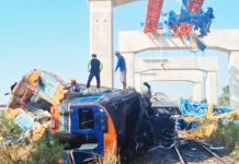 At least 32 killed after crane collapses on train in Thailand Emergency responders clamber over a mangled train after a crane collapsed in Thailand. BBC