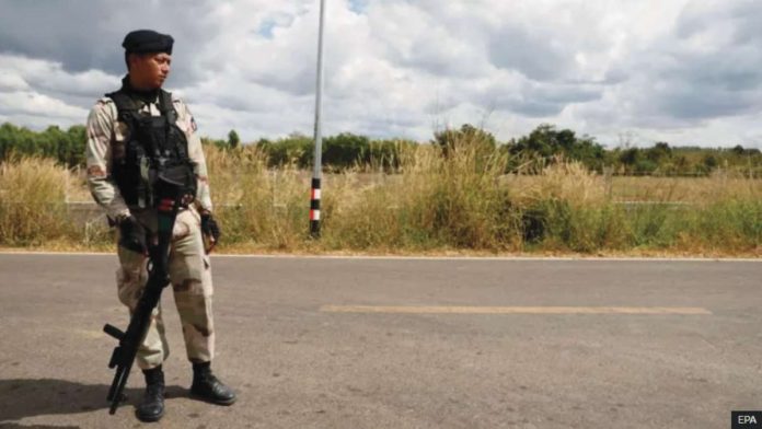 Thailand copy A Thai soldier stands on a road near the border with Cambodia. EPA