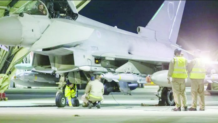 UK_resized_compressed Royal Air Force ground crew prepare an RAF Typhoon fighter jet. EPA/SHUTTERSTOCK