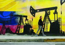 US-Venezuela tension won’t affect PH oil price — DOE The Department of Energy says the current oil crisis following the tension between the United States and Venezuela might not actually be a major impact on the global market, especially in the Philippines. Photo shows a local walking past a mural featuring oil pumps and wells in Caracas, Venezuela, on January 6, 2026. PHOTO COURTESY OF AP