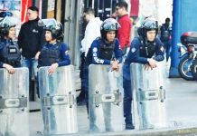 Venezuelan security forces detain foreign journalists Police officers stand guard near the National Assembly in Venezuela's capital, Caracas. REUTERS