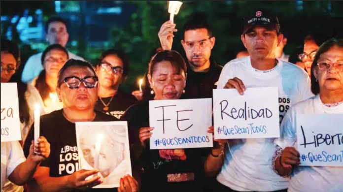 Venezuela Rows of people hold a vigil calling for the release of prisoners in Venezuela. EPA