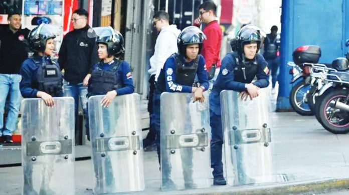 Venezuela Police officers stand guard near the National Assembly in Venezuela's capital, Caracas. REUTERS