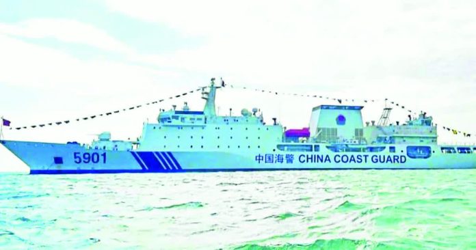 West_PH_Sea_copy_resized_compressed Filipino coast guardsmen aboard BRP Teresa Magbanua catch a glimpse of the largest China Coast Guard ship 5901 from a porthole at Escoda (Sabina) Shoal on July 3, 2024. FILE PHOTO FROM PCG