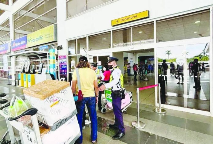 airport pic_compressed SECURITY WITHOUT X-RAY. This photo from the Civil Aviation Authority of the Philippines’ Facebook page shows security personnel conducting manual checks at the ground-floor entrance of the Iloilo International Airport, after the first layer of X-ray screening was removed in October 2025 to supposedly streamline passenger flow under a directive from the Department of Transportation. Arthur Parreño, CAAP-Iloilo terminal supervisor and public information officer, discusses security measures under review after a knife incident exposed gaps in passenger screening at the airport.