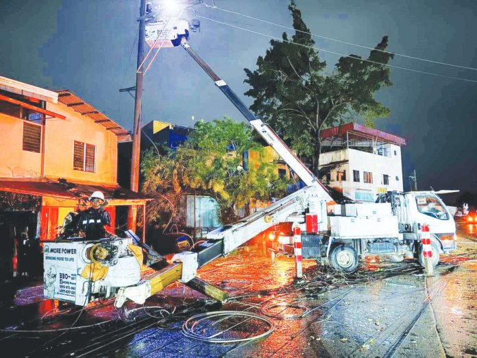 electric_coops_copy_resized_resized MORE Electric and Power Corporation linemen performed power restoration activities on Nov. 5, 2025 after several areas in Iloilo City experienced power interruptions due to Typhoon “Tino.” MORE POWER/FACEBOOK PHOTO