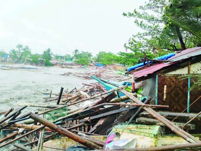 fisherfolk_farmers_aid_copy_resized_compressed Damage is seen along the coastline of Magsungay in Barangay Singcang-Airport, Bacolod City, where houses, pump boats, and other sources of livelihood were destroyed after Typhoon “Tino” battered the city under Signal No. 4 on November 4, 2025. COUNCILOR CAESAR DISTRITO PHOTO