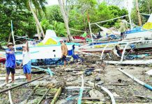 Strong waves batter 114 Concepcion fishing boats Fisherfolk inspect damaged pump boats strewn along the shoreline of Barangay Igbon, Concepcion, Iloilo after strong waves battered the coastal village over the weekend, destroying and damaging dozens of fishing vessels — the primary source of livelihood and transport for residents. PHOTO CONTRIBUTED BY AIROSE C. CALINAO