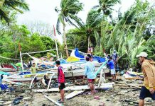 Livelihood losses mount; wave-battered Concepcion fishing boats climb to 216 AFTERMATH OF THE WAVES. Fishermen inspect and salvage damaged fishing boats along the coastline of Concepcion, Iloilo after strong waves battered the area over the weekend, leaving hundreds of boats wrecked or partially destroyed and disrupting the livelihood and transport of island communities. PHOTO CONTRIBUTED BY AIROSE C. CALINAO