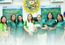 Personnel of Department of Social Welfare and Development-Negros Island Region turn over a check for seed capital fund (SCF) to a sustainable livelihood program association in Ilog, Negros Occidental in this photo released on Friday, Jan. 9, 2026. DSWD-NEGROS ISLAND REGION PHOTO