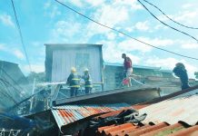 Firefighters battle a blaze that tore through tightly packed houses in Zone 1A, Barangay San Juan, Molo, Iloilo City on Sunday afternoon, January 18, leaving several homes destroyed and dozens of residents displaced. AJ PALCULLO/PN