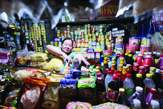 no_price_hikes_resized_compressed A vendor tends to her stall in Commonwealth Market in Quezon City in December 2025. The Department of Trade and Industry said on Wednesday, Jan. 21, 2026, that 186 out of 205 stock-keeping units of basic necessities and prime commodities recorded no price changes. INQUIRER PHOTO / GRIG C. MONTEGRANDE