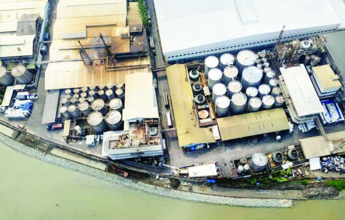 Factories and warehouses are seen along the Marikina River in Pasig City on December 2, 2025. FILE PHOTO BY GRIG C. MONTEGRANDE | INQUIRER