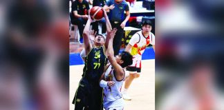 TNT Tropang 5G’s Kevin Ferrer attacks the defense of San Miguel Beermen’s Celedonio Trollano for an inside hit. PBA PHOTO