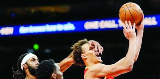 Atlanta Hawks guard Dyson Daniels shoots against Indiana Pacers guard Bennedict Mathurin during the second half of an NBA basketball game, Monday, Jan. 26, 2026, in Atlanta. AP PHOTO/MIKE STEWART