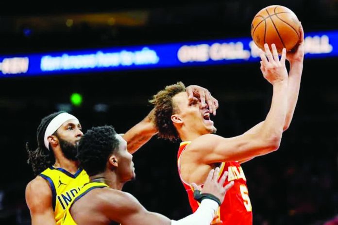 sports_Atlanta_resized_compressed Atlanta Hawks guard Dyson Daniels shoots against Indiana Pacers guard Bennedict Mathurin during the second half of an NBA basketball game, Monday, Jan. 26, 2026, in Atlanta. AP PHOTO/MIKE STEWART
