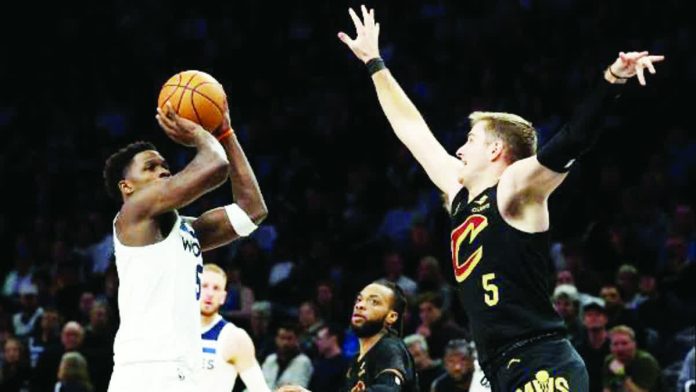 sports_Cleveland_resized_compressed Cleveland Cavaliers’ Sam Merrill looks to foil the shot attempt of Minnesota Timberwolves' Anthony Edwards. ESPN PHOTO