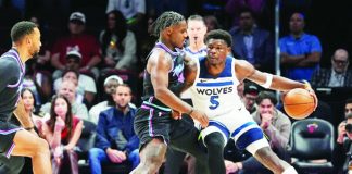 Minnesota Timberwolves' Anthony Edwards attacks the defense of Miami Heat guard Davion Mitchell. AP