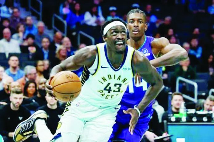 sports_Indiana_resized_compressed Indiana Pacers forward Paskal Siakam drives against the defense of Charlotte Hornets' Moussa Diabete. AP