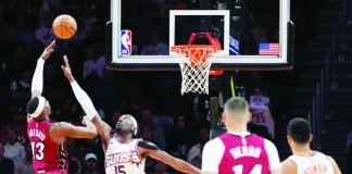 Miami Heat’s Bam Adebayo attempts a one-handed shot against the defense of Phoenix Suns’ Mark Williams. AP Photo. AP PHOTO