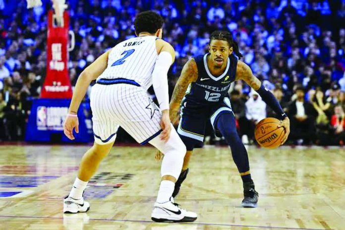 sports_Morant_resized_resized_compressed Memphis Grizzlies’ Ja Morant dribbles against the defense of Orlando Magic’s Tyus Jones. PHOTO BY GLYN KIRK/AFP
