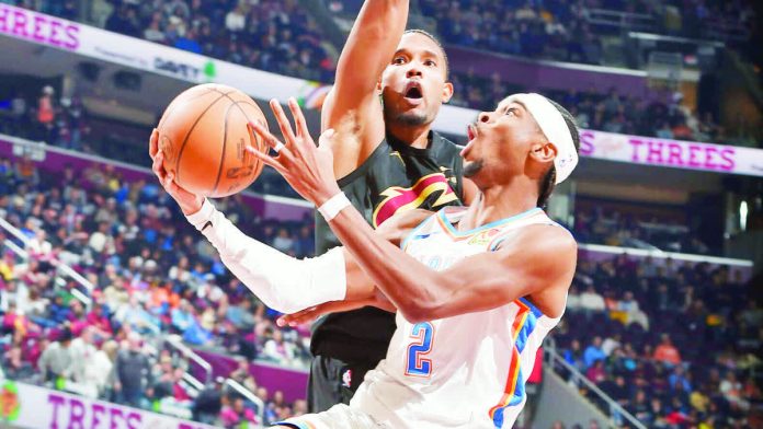 sports_SGA_resized_compressed Oklahoma City Thunder guard Shai Gilgeous-Alexander tries to score against the defense of Cleveland Cavaliers' Evan Mobley. GETTY IMAGES