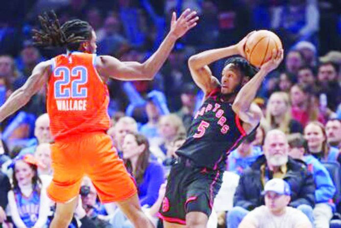 Toronto Raptors’ Immanuel Quickley looks to pass the ball after being bothered by the defense of Oklahoma City Thunder’s Cason Wallace. AP