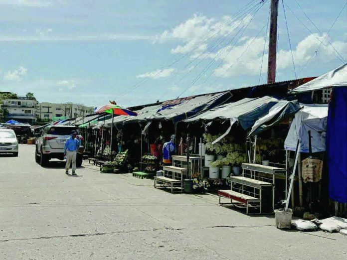 Bacolod flower vendors copy_compressed Flower vendors along Fr. M. Ferrero Street in Barangay 12, Bacolod City will be relocated as part of the ongoing redevelopment of the Reclamation Area. MAE SINGUAY/PN