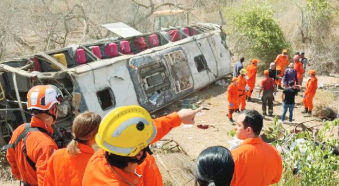 Brazil A bus lies on its side, surrounded by emergency workers in Brazil. GOVERNMENT OF ALAGOAS