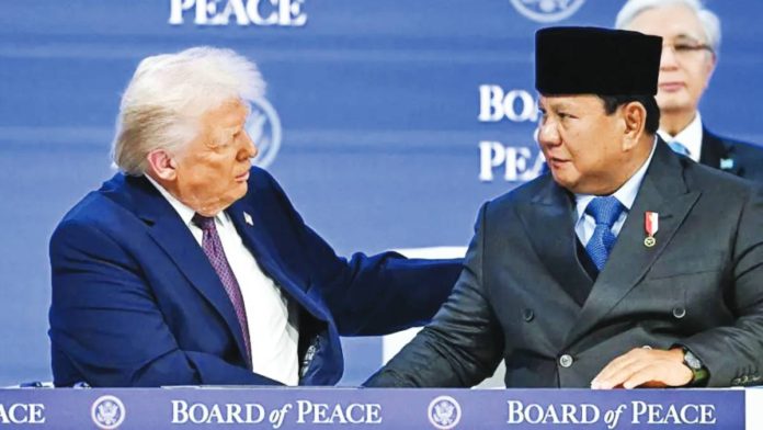 Indonesia United States President Donald Trump (left) shakes hands with Indonesia's President Prabowo Subianto at a signing ceremony for the new Board of Peace, during the World Economic Forum (WEF) annual meeting in Davos, Switzerland on January 22, 2026. Subianto has argued that Indonesia should help to stabilize Gaza. AFP VIA GETTY IMAGES