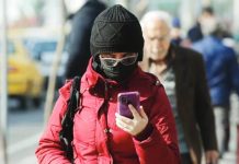 An Iranian checks his mobile phone for an internet connection. The country cut off internet access on January 8, in what is widely seen as an attempt to stem the flow of information about a government crackdown on protesters. GETTY IMAGES