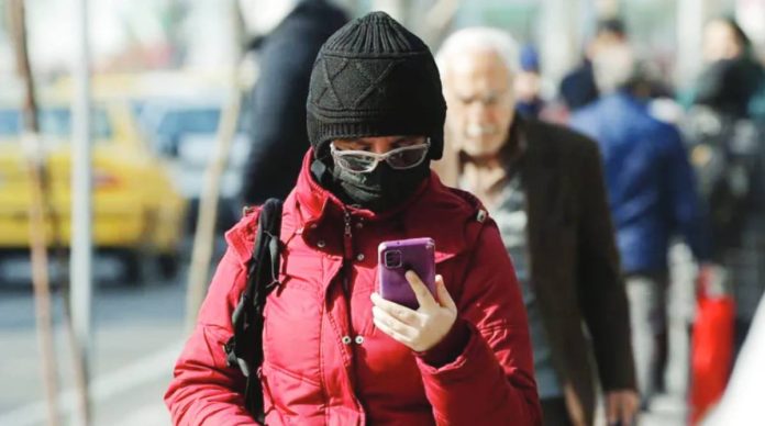 Iran An Iranian checks his mobile phone for an internet connection. The country cut off internet access on January 8, in what is widely seen as an attempt to stem the flow of information about a government crackdown on protesters. GETTY IMAGES