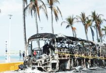Threat of further violence looms after Mexican drug cartel rampage Photo shows burned out vehicles on the boardwalk in Puerto Vallarta, Mexico caused by rampaging members of a drug cartel. EPA