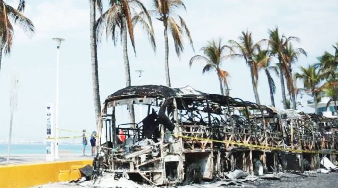 Photo shows burned out vehicles on the boardwalk in Puerto Vallarta, Mexico caused by rampaging members of a drug cartel. EPA