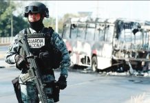 At least 25 killed in violence after death of Mexican drug lord A National Guard member stands guard near a burnt bus set on fire by organized crime groups in response to an operation in Jalisco to arrest a high-priority security target, at one of the main avenues in Zapopan, state of Jalisco, Mexico, on February 22, 2026. GETTY IMAGES