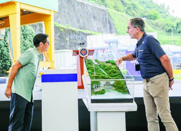 PBBM touts copy_compressed President Ferdinand Marcos Jr. says the government continues to boost the systems in the country’s energy sector to ensure power reliability and affordability for the benefit of the people. He is shown here viewing a diorama of the Caliraya-Botocan-Kalayaan Hydroelectric Power Plants (CBK HEPP) in Kalayaan, Laguna during the latter’s turnover yesterday. PCO