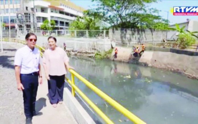 President Ferdinand R. Marcos Jr. and Naga City’s Mayor Leni Robredo inspect ongoing operations under Oplan Kontra Baha at Sagop Creek in Barangay Triangulo on February 21, 2026. PNA