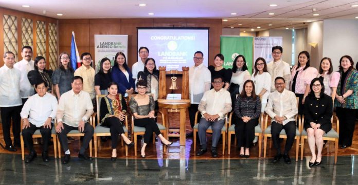 LANDBANK President and CEO Lynette V. Ortiz (seated 4th from left), SEC Chairperson Francis Edralin Lim (seated 5th from left), and PDEx President Stephanie Marie A. Zulueta (seated rightmost), together with representatives from LANDBANK, SEC, and PDEx, lead the official listing ceremony of LANDBANK’s ₱50‑billion ASENSO Bonds on 16 February 2026. The listing marks the entry of the bonds into the secondary market, expanding opportunities for investors.