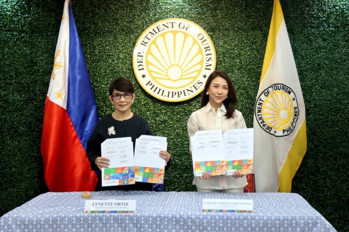 Tourism Secretary Ma. Esperanza Christina C. Frasco (right) and LANDBANK President and CEO Lynette V. Ortiz (left) signed two agreements to digitalize tourism-related payments and streamline the Department's procurement processes on 13 January 2026 at the New DOT Building in Makati City.