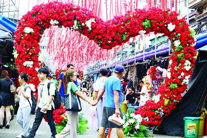 SWS_copy_resized_compressed Customers flock to Dangwa Flower Market in Manila. Vendors always make a killing on Valentine's month. PNA