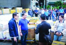 Finance Secretary Frederick Go and Customs Commissioner Ariel Nepomuceno lead the distribution of balikbayan boxes to families of OFWs on Wednesday, Feb. 18, 2026, at the BOC grounds in Port Area, Manila. PHOTO COURTESY OF BOC
