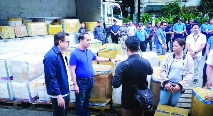 balikbayan_boxes_resized_compressed Finance Secretary Frederick Go and Customs Commissioner Ariel Nepomuceno lead the distribution of balikbayan boxes to families of OFWs on Wednesday, Feb. 18, 2026, at the BOC grounds in Port Area, Manila. PHOTO COURTESY OF BOC