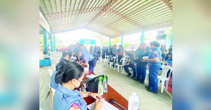 drug testing_superimposed_compressed Iloilo Police Provincial Office (IPPO) personnel gather at the Ilonggo Cops Covered Gym in Camp Francisco U. Sumagaysay Sr., Sta. Barbara, Iloilo on Tuesday, Feb. 24, to undergo the second round of mandatory drug testing for 2026. IPPO PHOTO