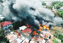 City gov’t rushes to aid 387 displaced by Jaro fire that gutted 90 homes More than 20 houses were razed after a massive fire broke out on Monday afternoon, February 16, 2026, in Barangay Benedicto, Jaro, Iloilo City. Thick black smoke billowed over the area as firefighters, emergency responders and residents rushed to contain the blaze. MORE POWER / AJ PALCULLO PHOTOS