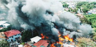 More than 20 houses were razed after a massive fire broke out on Monday afternoon, February 16, 2026, in Barangay Benedicto, Jaro, Iloilo City. Thick black smoke billowed over the area as firefighters, emergency responders and residents rushed to contain the blaze. MORE POWER / AJ PALCULLO PHOTOS