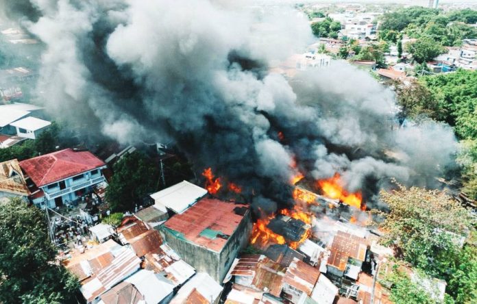 fire1 More than 20 houses were razed after a massive fire broke out on Monday afternoon, February 16, 2026, in Barangay Benedicto, Jaro, Iloilo City. Thick black smoke billowed over the area as firefighters, emergency responders and residents rushed to contain the blaze. MORE POWER / AJ PALCULLO PHOTOS